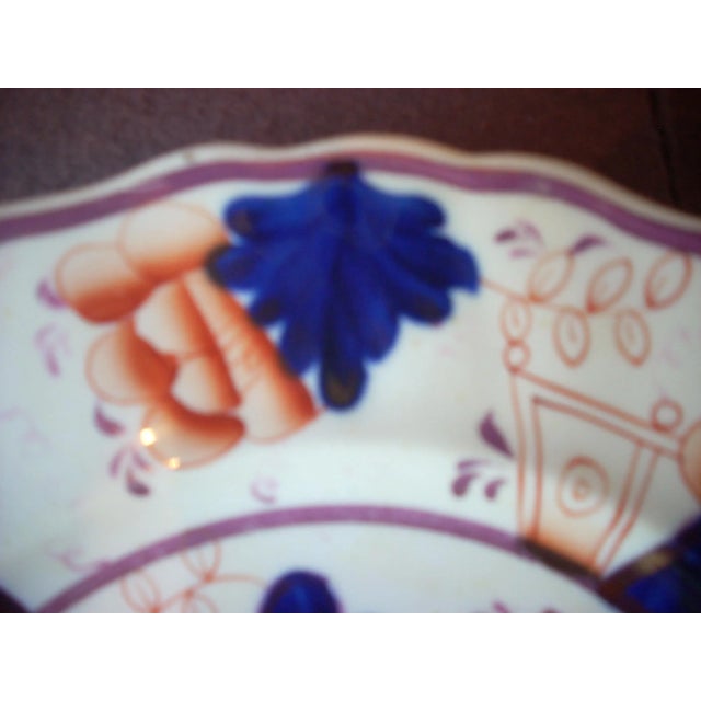 Made in England 1835-1850; fine English soft paste translucent ; decorated in the "Buckle" pattern in cobalt, orange and...