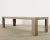 Monumental rectangular dining table measuring 10 feet long featuring an oak veneer with a distressed, cerused stained...