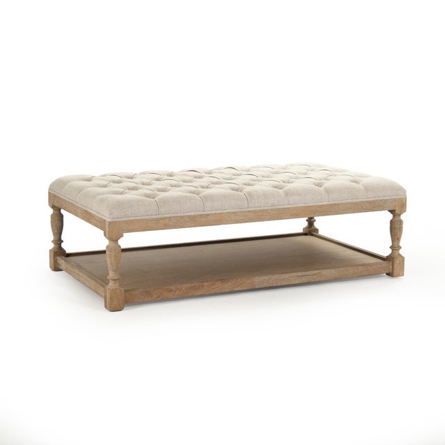 The Rectangular Tufted Ottoman from Zentique is a versatile coffee table alternative with a button-tufted cream linen top...