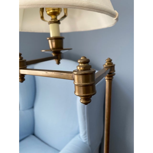 Vintage brass floor lamp with perfect patination. This lamp is adjustable with an articulating arm that provides luminous...