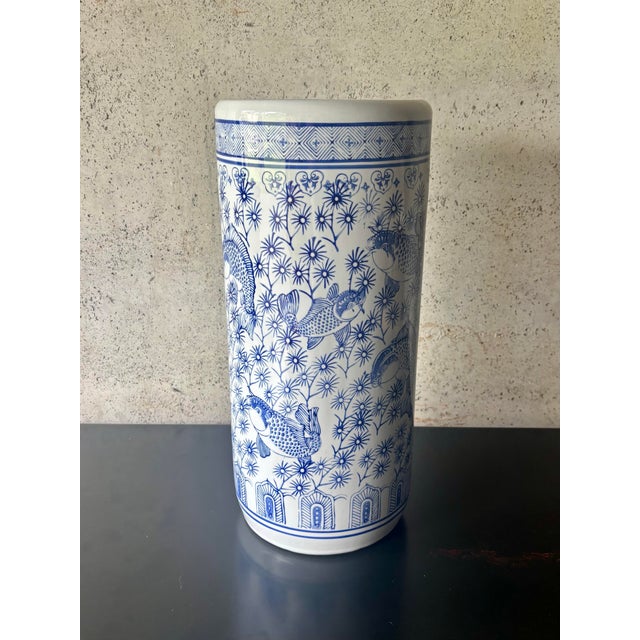 Vintage Chinese blue and white porcelain umbrella or cane stand, featuring an intricate allover aquatic motif of swimming...