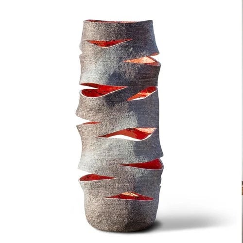 EMBER High by Donatas Zukauskas A dual-purpose sculptural object: by day, a tall stone-look vessel with the presence and...
