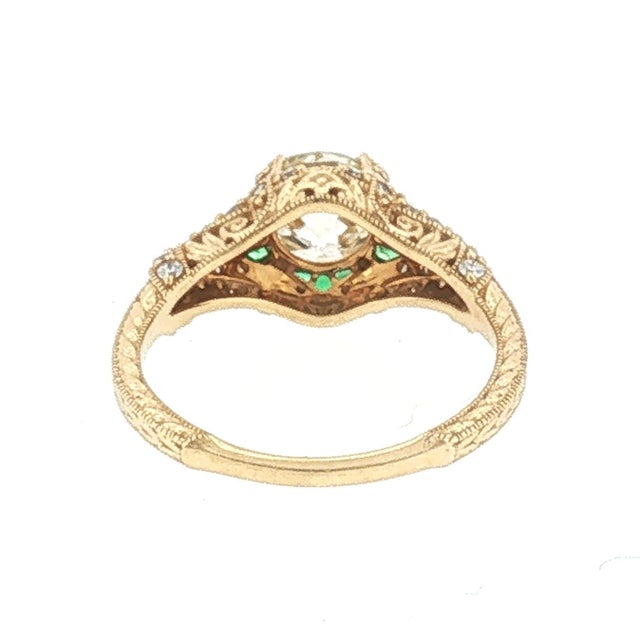 A modern 14k gold engagement ring featuring a repurposed 1.38-carat Old European-cut diamond. The primary diamond K color...