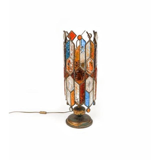 Amazing big Midcentury table lamp or floor lamp in golden wrought iron and multi-color hammered glass produced by...