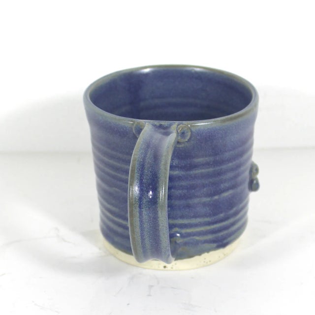 Elevate your morning cup with this unique, handmade vintage artisan studio pottery mug. This mug is truly charming. It is...