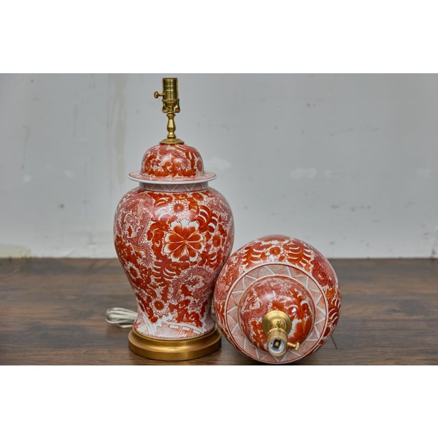 A vibrant pair of red and white porcelain temple jars table lamps and wired for use in the USA. With their commanding...