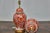A vibrant pair of red and white porcelain temple jars table lamps and wired for use in the USA. With their commanding...