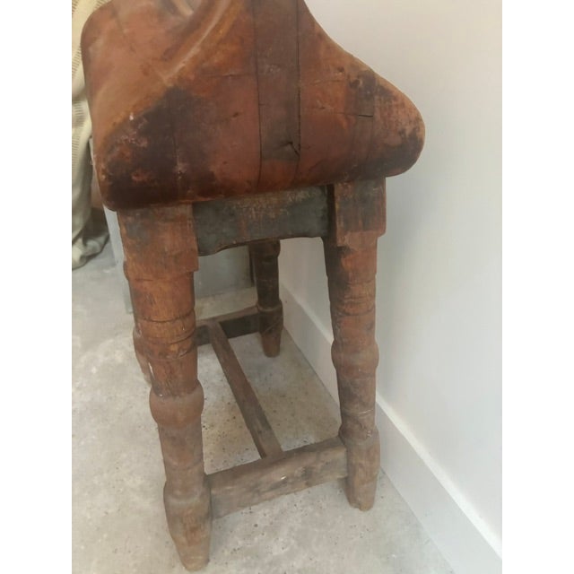 A sculptural vintage handmade saddle stand. Beautiful patina and practical storage for your saddle