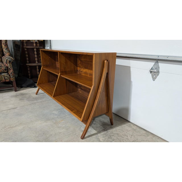 This bookcase measures: 59 wide x 16.5 deep x 31 inches high. A classic piece in great condition with just a few minor...