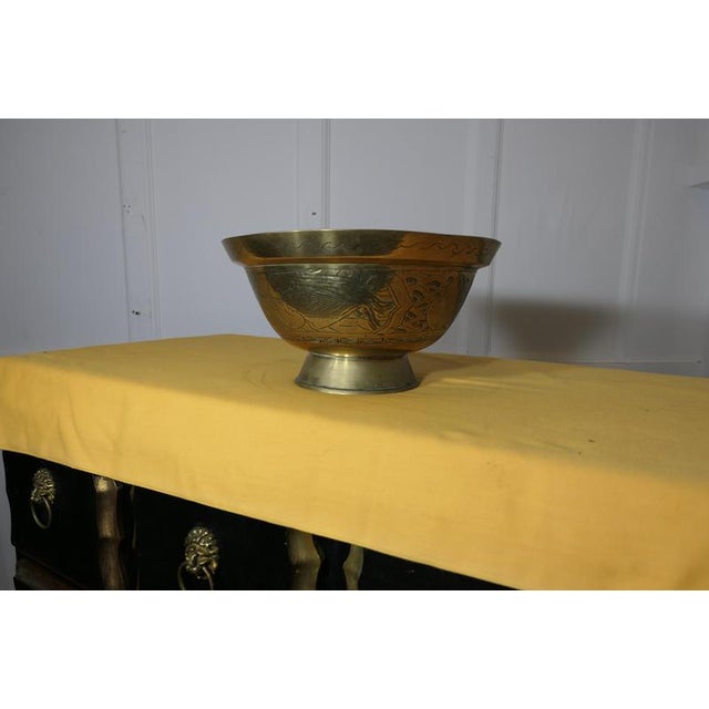 19th Century Engraved Brass Bowl This is a lovely piece, it has a good rounded shape with a larger lip around the top, the...