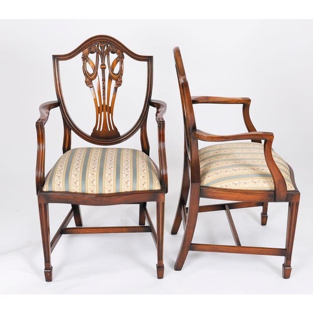 This is an absolutely fantastic English-made set of twelve Sheraton style Shieldback dining chairs bought at great expense...