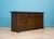 1970s Younger ‘Toledo’ sideboard in dark oak, with geometric panelled doors and carved drawer fronts. Three drawers above...