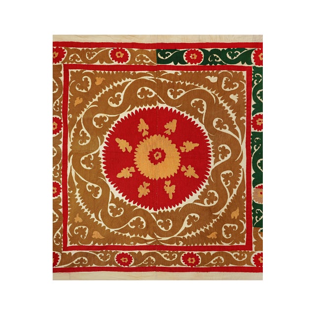 Vintage Suzani from Samarkand, circa 1900s. There are STAINS on this suzani. While this suzani is in wonderful condition,...