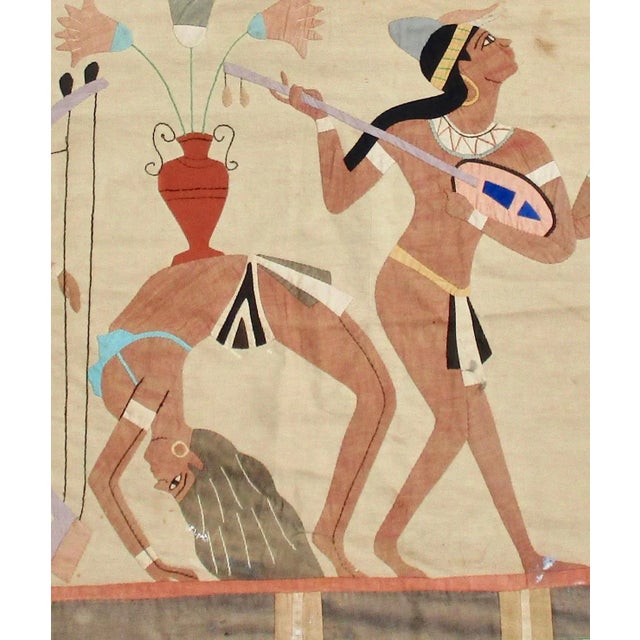 Egyptian linen applique textile of ancient wall scene. From the '70s and made of linen in soft earth tones, featuring...