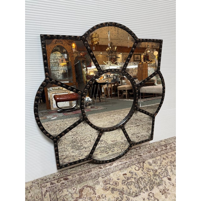 Design Plus Gallery presents a Nailhead Studded Wall Mirror in Flower Shape and Medieval Revival Style. The mirror has...