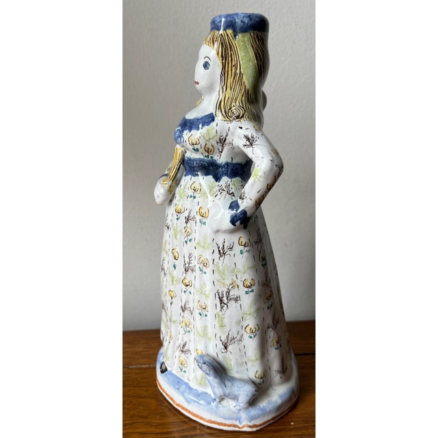 This rare hand-painted figurine or candlestick is of a woman holding a fan with a small dog at her feet. Made in Portugal,...