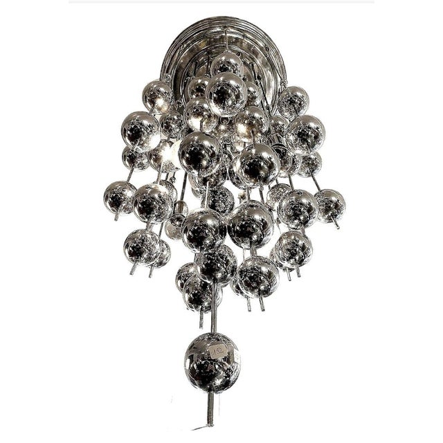 Bring pure Space‑Age drama to any interior with this spectacular 1970s “Ball” cascade chandelier, designed in Switzerland...