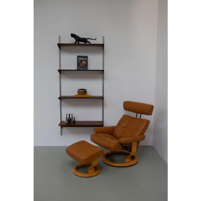 Ekornes Stressless Reclining Lounge Chair and Ottoman, 2000s. Scandinavian Mid-Century Modern recliner with footstool...