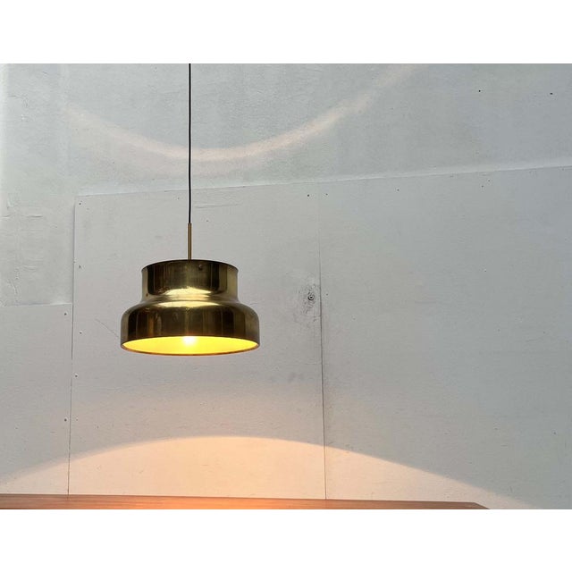The bumling lamp by atelje lyktan, designed by anders pehrson in the 1960s. This is a special version in brass with a...