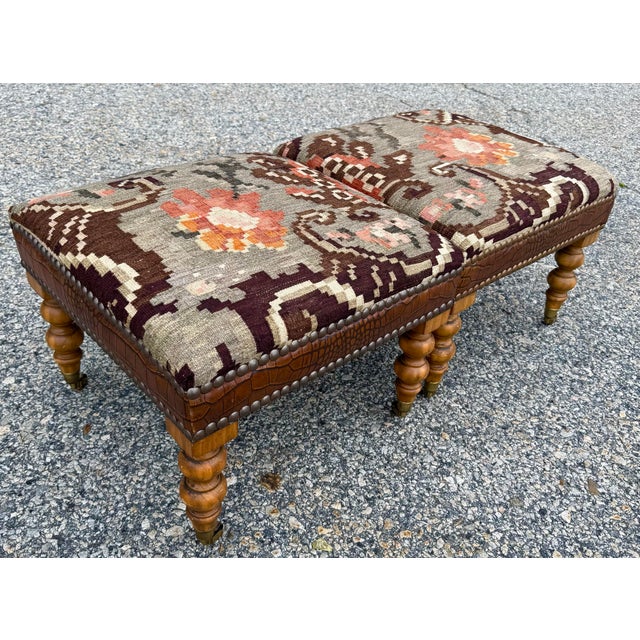 George Smith Standard Style Ottomans in Kilim and Alligator leather with nailhead trim on turned legs with antiqued brass...
