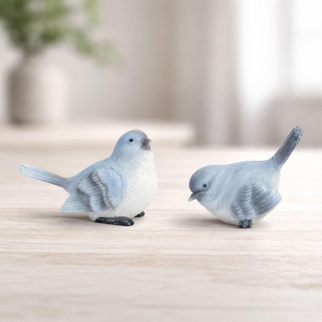 Add a sweet touch of nature to your home décor with this charming blue songbird figurine set. Featuring soft blue and...
