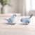 Add a sweet touch of nature to your home décor with this charming blue songbird figurine set. Featuring soft blue and...
