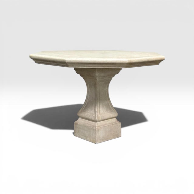 A classic dining table from Michael Taylor. Suitable for indoor or outdoor use, the table has a traditional limestone...