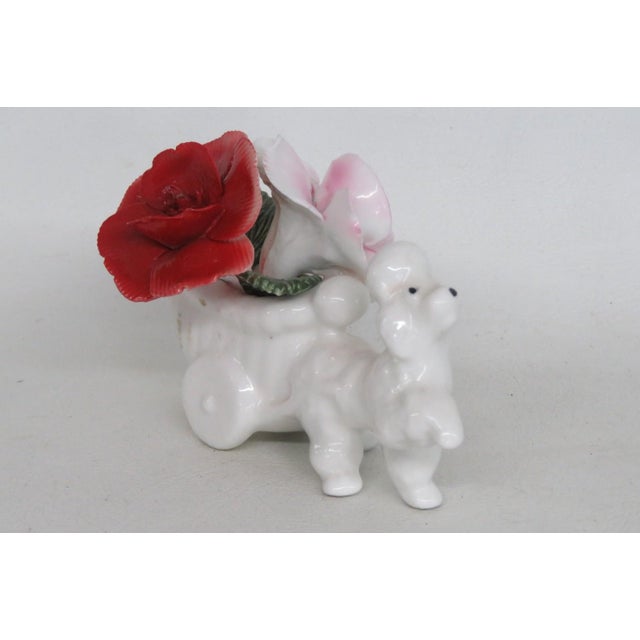 This gorgeous Poodle Figurine is made of bone china. This darling collectible is marked on the bottom with the following...