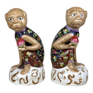 Vintage Chinese Chinoiserie Porcelain Monkey Holding Peach Sculpture - A Pair For Sale