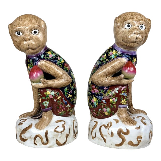Vintage Chinese Chinoiserie Porcelain Monkey Holding Peach Sculpture - A Pair For Sale
