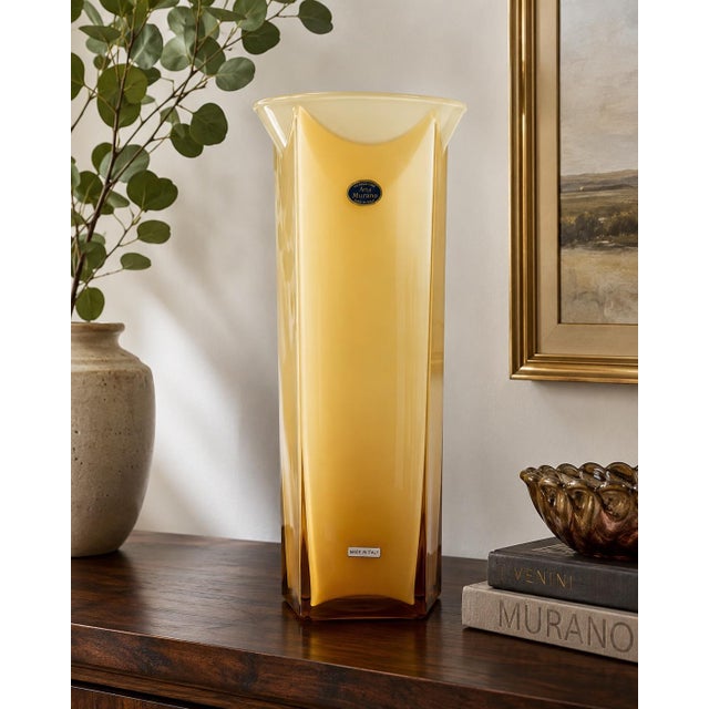 This elegant hand-blown Murano art glass vase showcases a clean architectural silhouette with four gently concave sides, a...