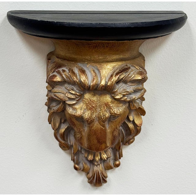 Unique vintage gilded and black painted wooden picture wall shelf with majestic lion head design. Plate channel on top....