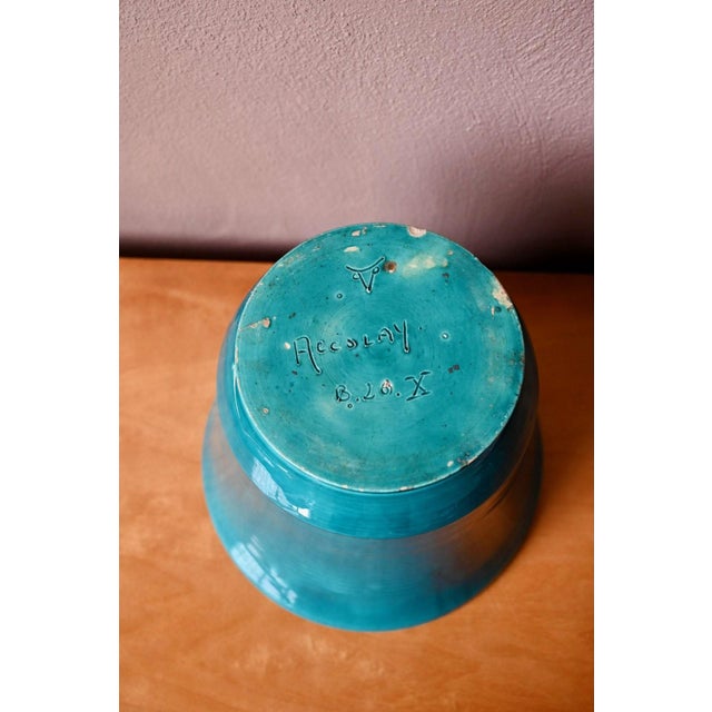 It's time to bring a touch of spring into your home. This planter, with its nuanced, ringed, peacock-blue glaze, is a...