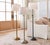 Chelsea floor lamp. In Color Pewter or silver as pictured in the center of the photo. This lamp will go from 50 inches to...