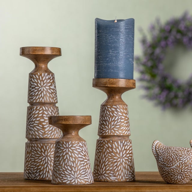 Add charm and elegance to your space with this set of three Etched Candle Holders. Crafted from durable resin, each holder...