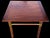 This is a pair of mid-century modern low profile side tables by Bert England. They are rosewood with bands of rosewood and...