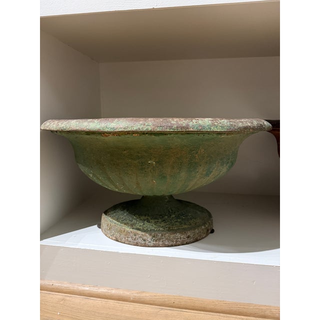 Bring classical elegance and rich character to your space with this antique cast iron garden urn finished in a beautifully...