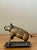 A delightful and functional piece of vintage Americana, this cast brass pig is both a mechanical cigar cutter and a...