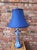 An unusual late nineteenth century Delft candlestick lamp decorated with tulip baskets and stylized S scroll motif with...