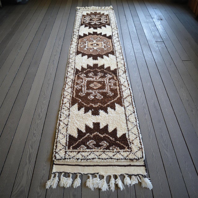 This authentic 1980s Anatolian tribal runner is a masterclass in organic texture and primitive geometry. Woven by village...