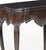 Portuguese style tea table in Noble Wood, King Jose style; carved Noble Wood; decorated with vegetal motifs. Rests on four...