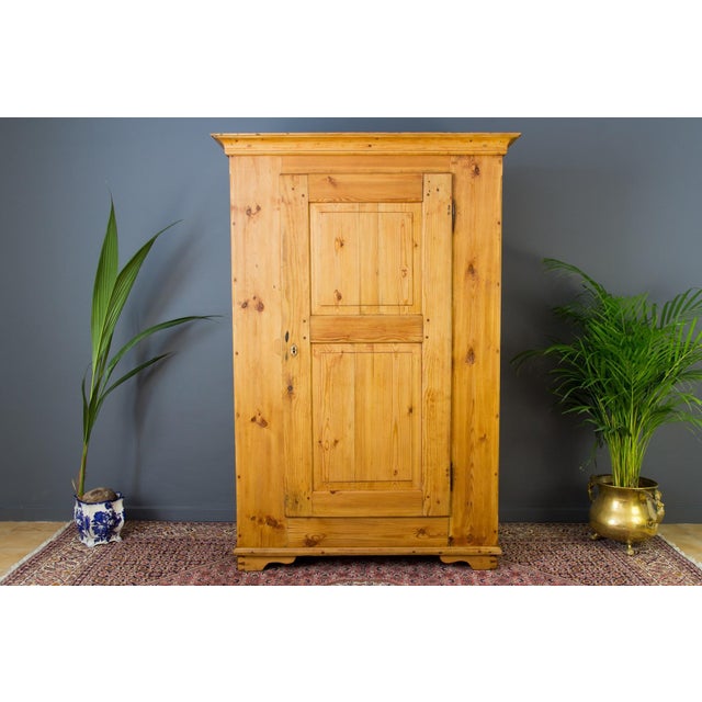 One-door armoire of Baltic pine with five shelves. The wardrobe is in one piece and is of very solid construction and is...
