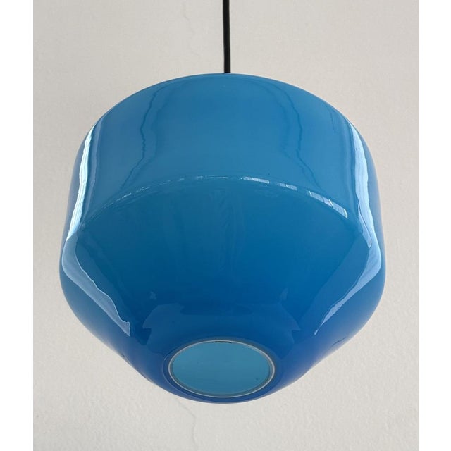 A beautiful blue glass lamp made in Murano using the overlay technique. The glass is white on the inside and blue on the...
