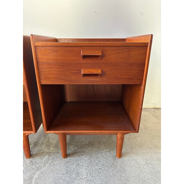 Danish modern pair of teak nightstands designed by Borge Mogensen, one of the top leading and highly coveted furniture...
