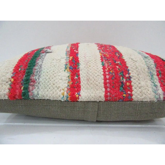 This is a pillow cover made from a vintage kilim rug. The piece was properly washed and ready to use. Pillow inserts not...