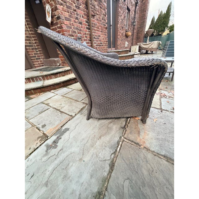 The is traditional Wicker Loveseat and Cocktail Table in the style of Lloyd Flanders combines timeless design with...