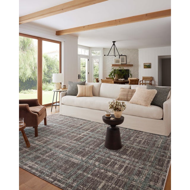 The Ember Collection by Angela Rose x Loloi is a modern flatweave area rug with a timeless plaid pattern that adds depth...