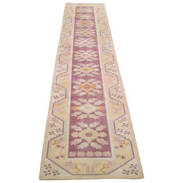 Vintage Turkish Anatolian hand knotted wool runner rug with natural colors.