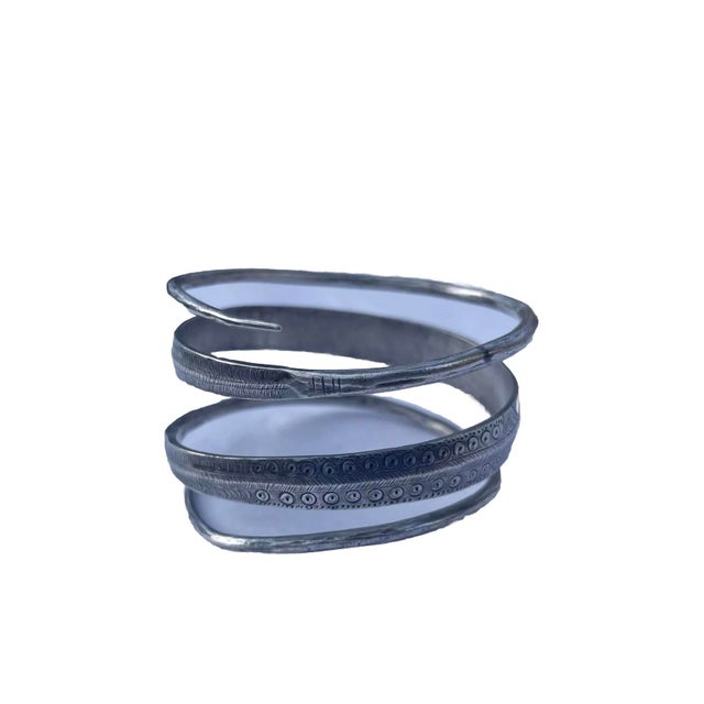 Rare find! Solid sterling Hmong bracelet symmetrical engraving over all three rows. This wrap feature lets any sized wrist...