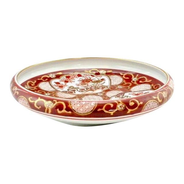 Large 10 inch Imari console bowl in iron red, sienna, peach and tan on a white background with gold accents. Marked “Gold...